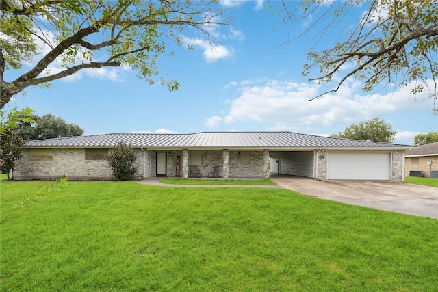 ranch-style home featuring a garage and a front lawn