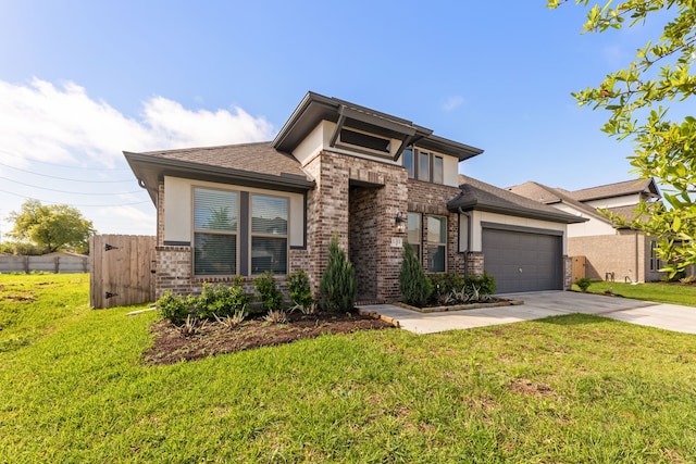 prairie-style house featuring a front yard and a garage