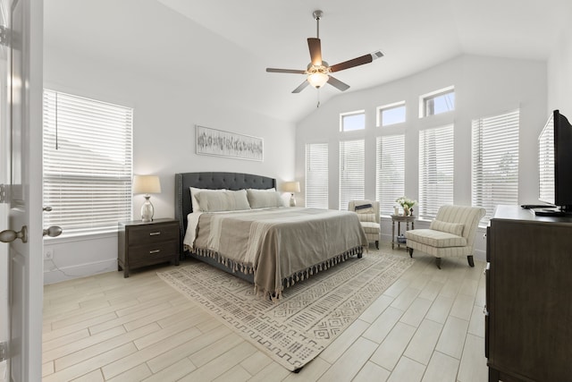 bedroom featuring ceiling fan, light wood-type flooring, and lofted ceiling