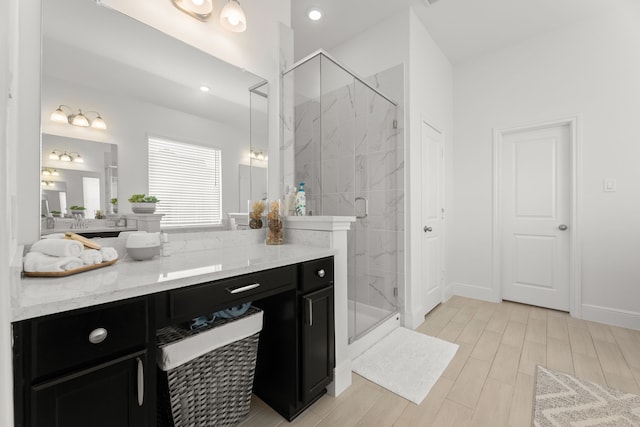 bathroom featuring vanity, hardwood / wood-style floors, and an enclosed shower