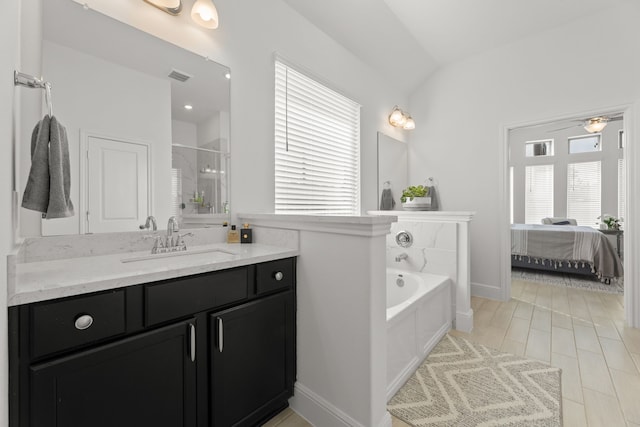 bathroom with ceiling fan, vanity, plus walk in shower, and vaulted ceiling