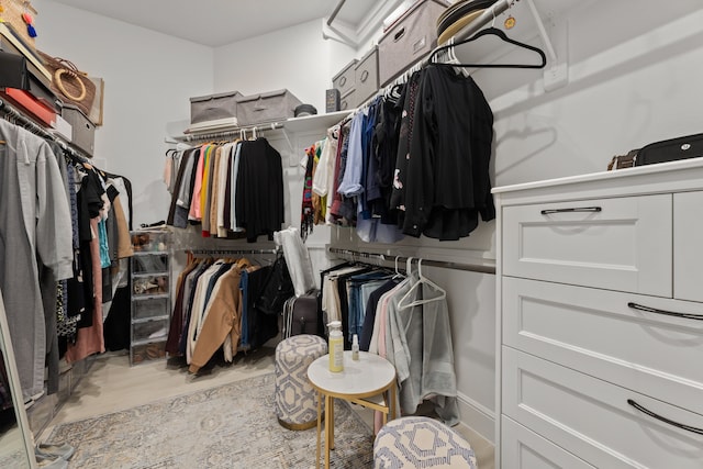 walk in closet featuring light hardwood / wood-style floors