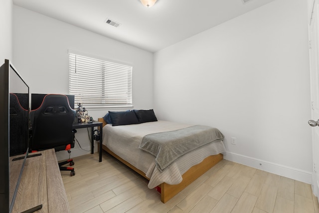 bedroom with light hardwood / wood-style floors