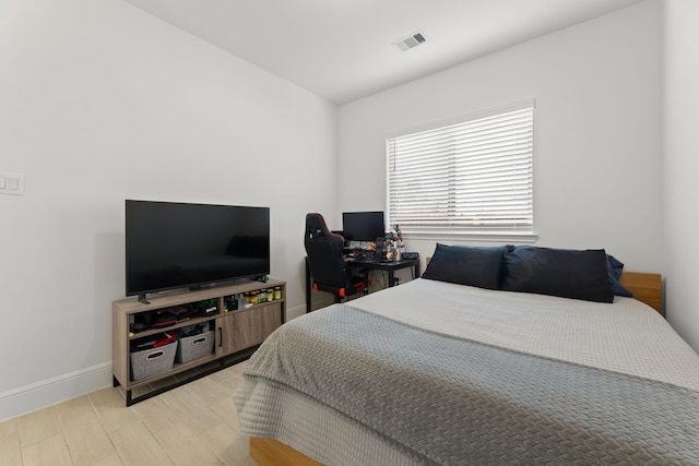 bedroom with light wood-type flooring