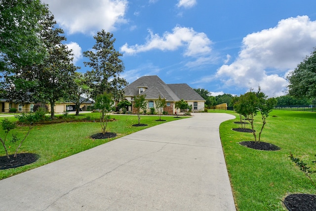 french provincial home featuring a front lawn