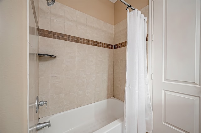 bathroom featuring shower / bath combo with shower curtain