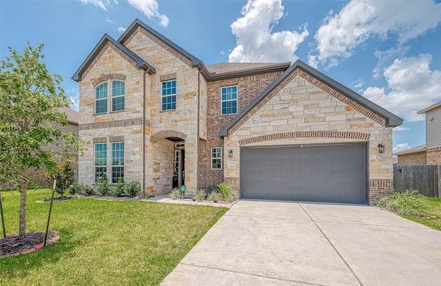 view of front of home featuring a garage and a front yard