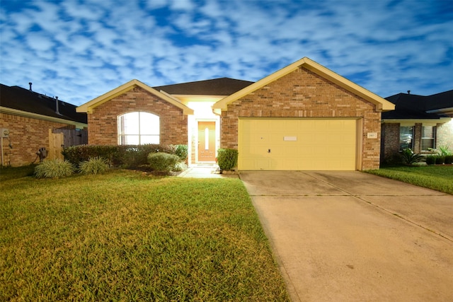 single story home with a garage and a front lawn