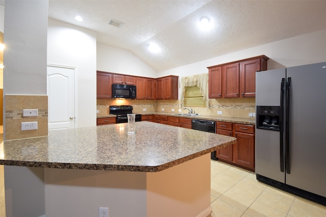 kitchen with a textured ceiling, sink, lofted ceiling, black appliances, and backsplash