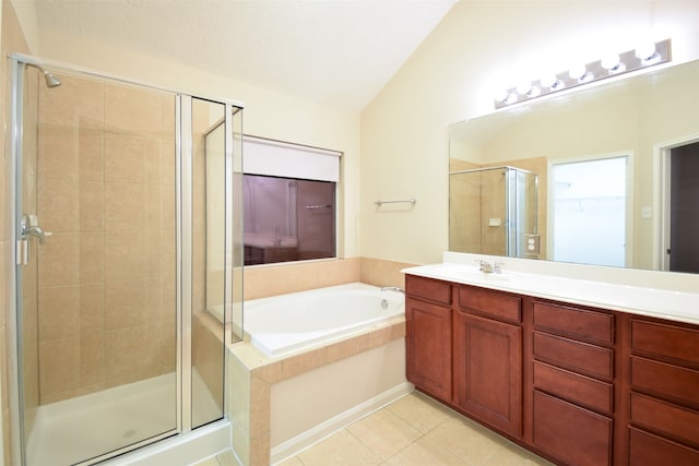 bathroom featuring independent shower and bath, vaulted ceiling, and vanity