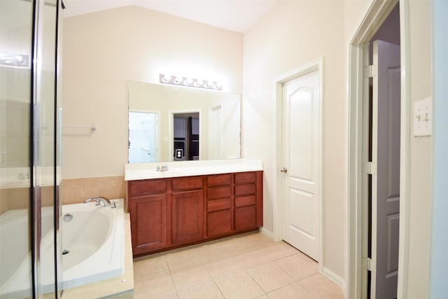 bathroom featuring plus walk in shower, lofted ceiling, tile patterned floors, and vanity