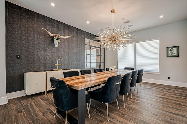 dining room featuring dark hardwood / wood-style floors and a chandelier