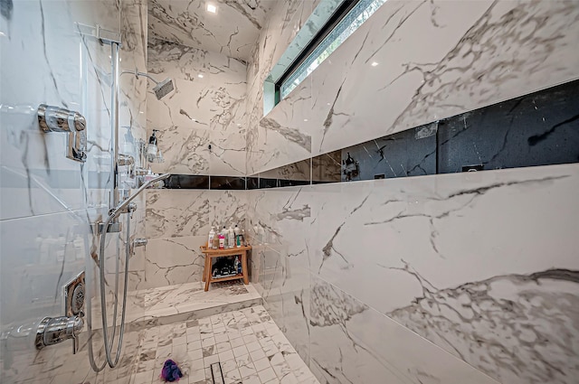 bathroom with tiled shower