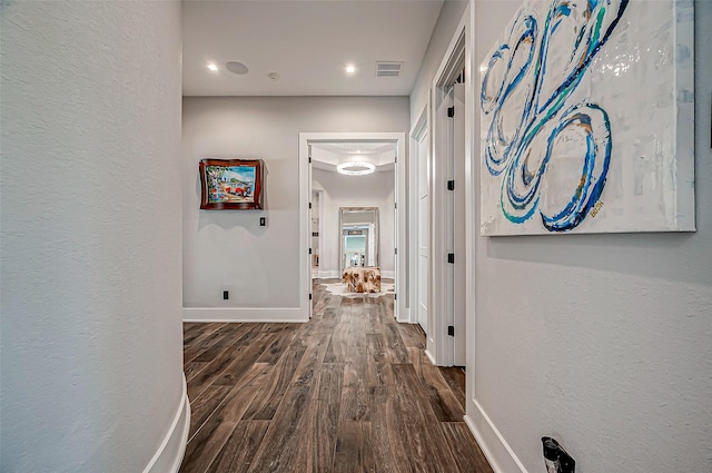 hall with dark hardwood / wood-style floors