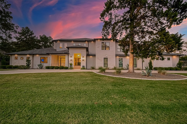 view of front of home with a yard