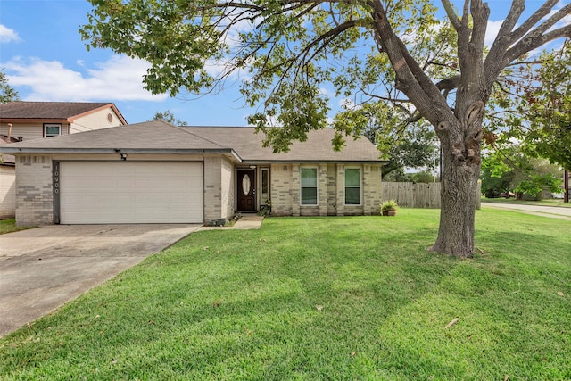 ranch-style home with a front yard and a garage