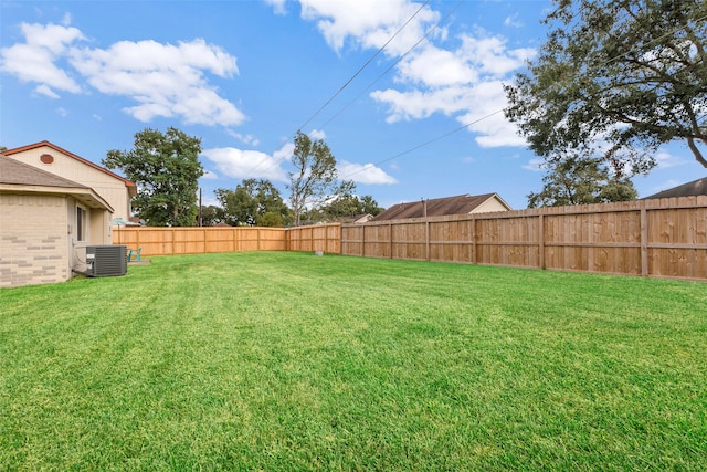 view of yard featuring central AC