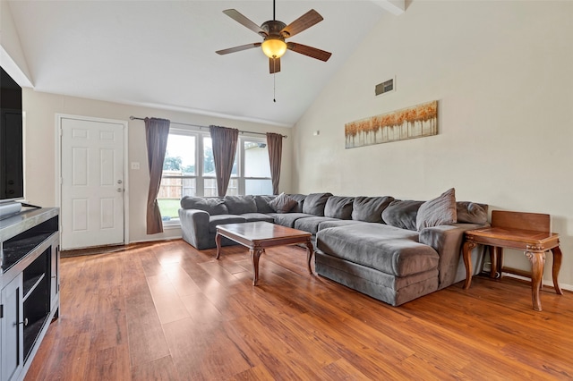 living room with high vaulted ceiling, ceiling fan, and hardwood / wood-style flooring