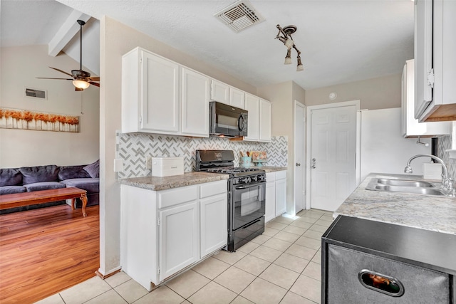 kitchen with white cabinets, black appliances, light wood-type flooring, and sink