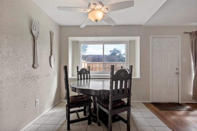 dining area with light hardwood / wood-style floors and ceiling fan