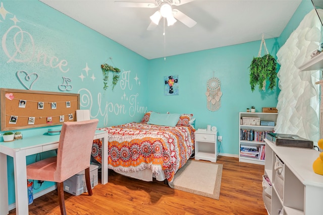 bedroom with wood-type flooring and ceiling fan