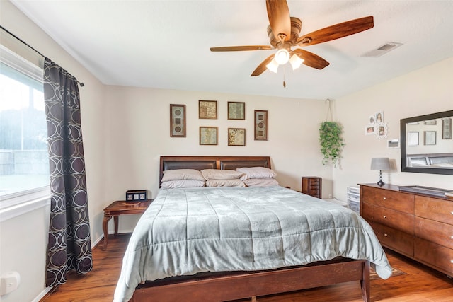 bedroom with wood-type flooring and ceiling fan