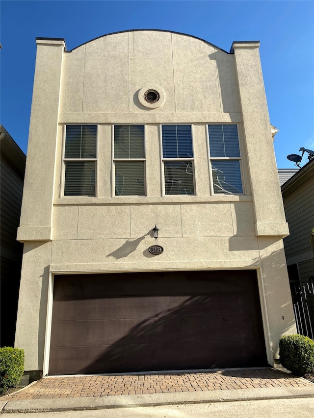 view of front of home with a garage