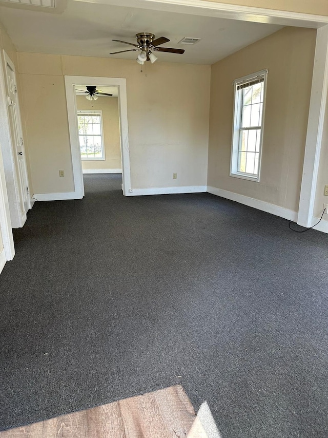 carpeted empty room with ceiling fan