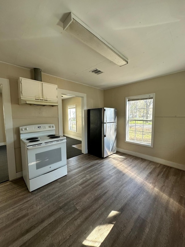 kitchen with dark hardwood / wood-style floors, range hood, white cabinets, stainless steel refrigerator, and white electric stove