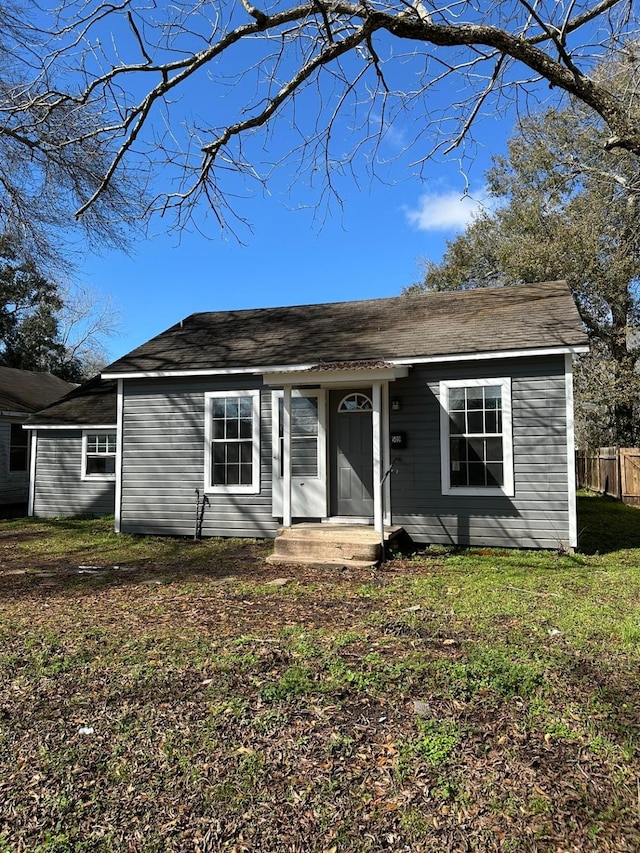 ranch-style home with a front yard