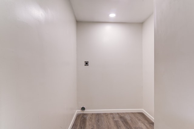 washroom featuring wood-type flooring and electric dryer hookup