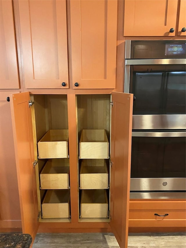 9614 Greenwillow St, Houston, TX 77096 - kitchen view of stainless steel double oven and light wood-type flooring