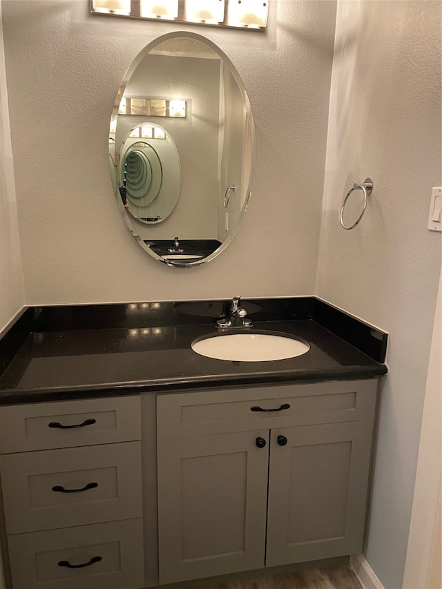 bathroom featuring vanity and hardwood / wood-style flooring