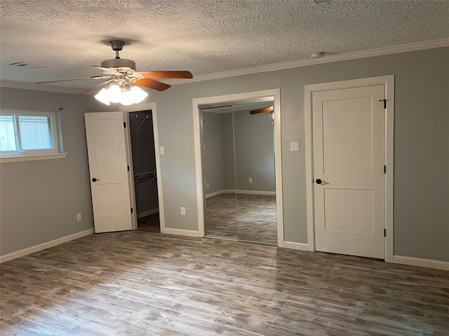 9614 Greenwillow St, Houston, TX 77096 - unfurnished bedroom featuring wood finished floors, a textured ceiling, ornamental molding, baseboards, and a ceiling fan