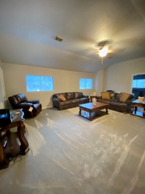 living room featuring carpet flooring, lofted ceiling, and ceiling fan