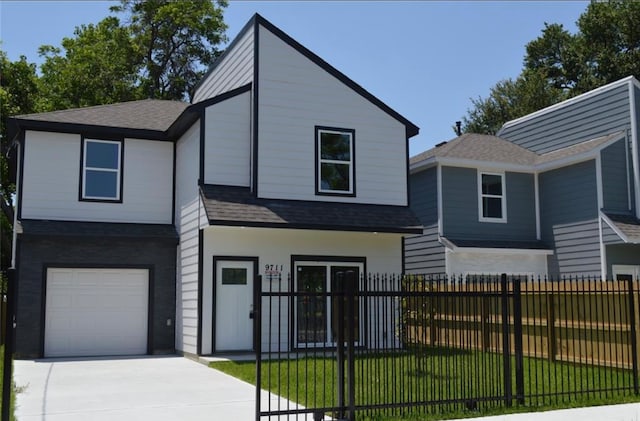 view of front of home with a garage and a front lawn