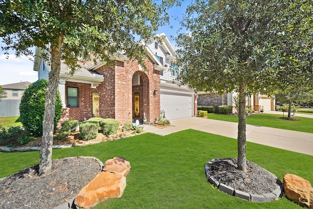 view of front of home featuring a garage and a front yard