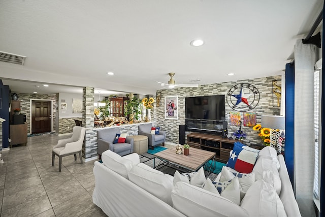 tiled living room featuring ceiling fan