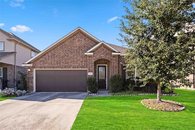 view of front facade with a garage and a front lawn