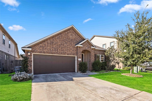 front facade with a garage and a front lawn