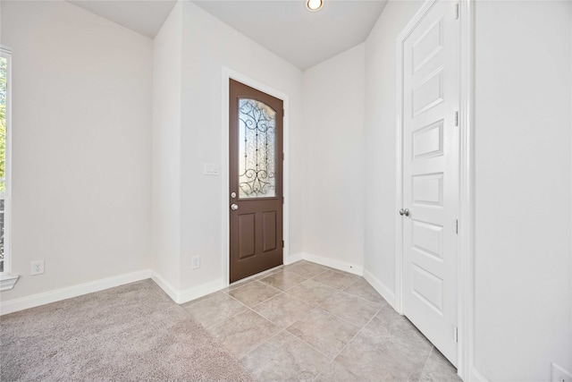 entryway featuring light tile patterned flooring