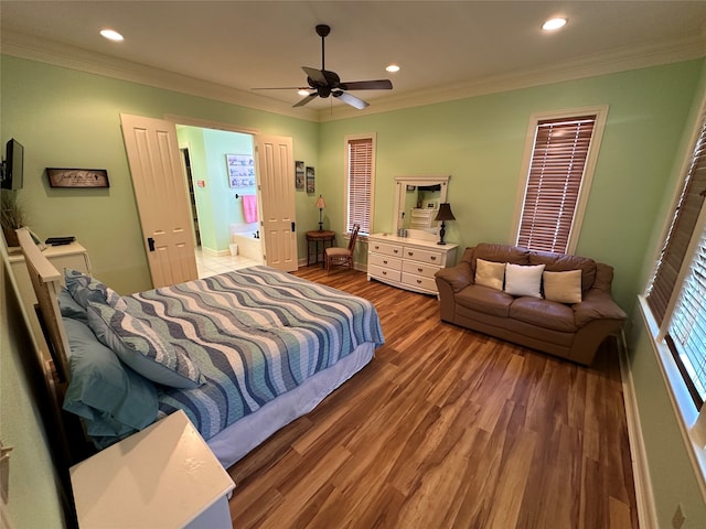 bedroom with crown molding, ceiling fan, and dark hardwood / wood-style flooring