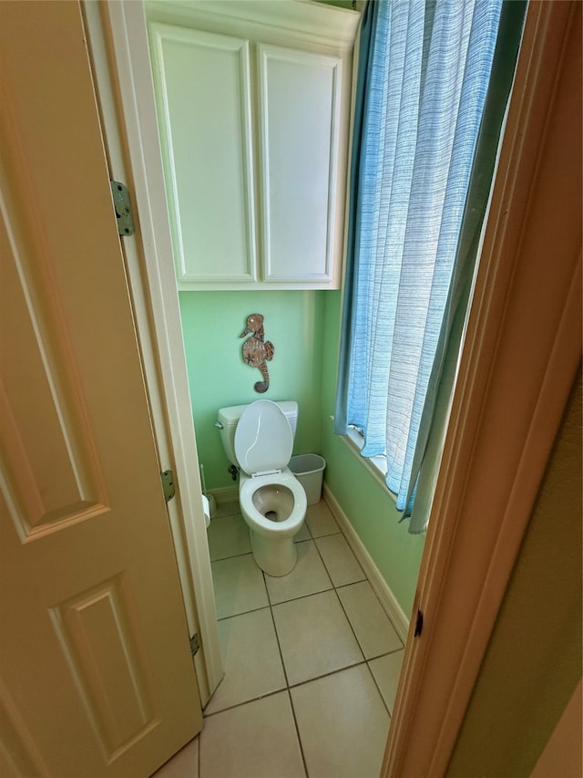 bathroom featuring tile patterned flooring and toilet