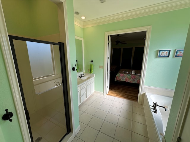 bathroom with ceiling fan, vanity, plus walk in shower, tile patterned flooring, and ornamental molding