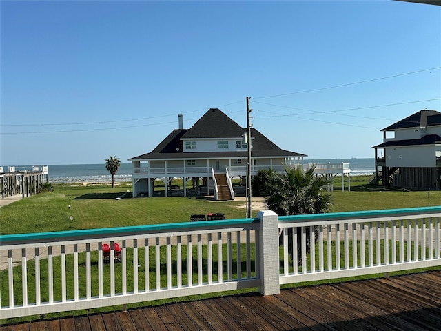 exterior space featuring a yard and a water view