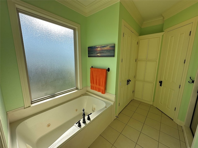 bathroom with a bathing tub, plenty of natural light, crown molding, and tile patterned floors