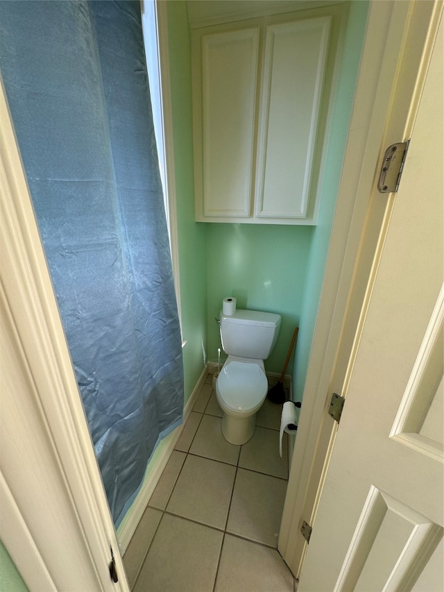 bathroom featuring tile patterned floors and toilet