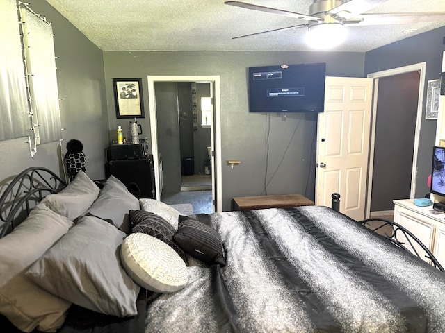 bedroom featuring a textured ceiling and ceiling fan