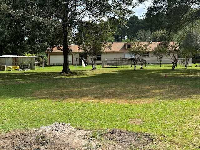 view of yard with a garage