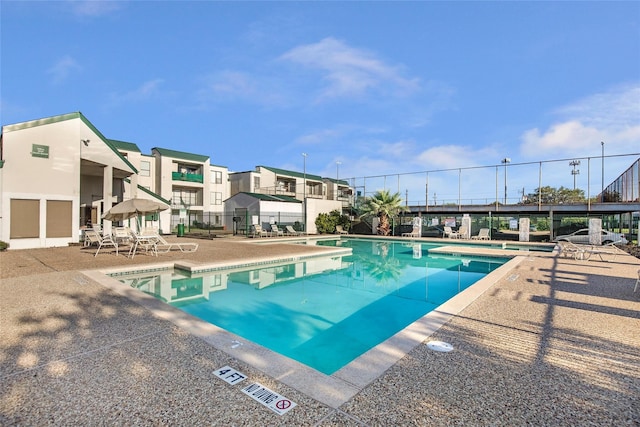 view of swimming pool featuring a patio